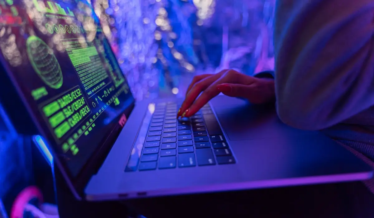 a person typing on a laptop